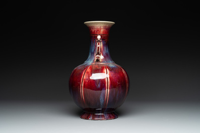 A Chinese flamb&eacute;-glazed vase with archaistic dragon handles, 19th C.