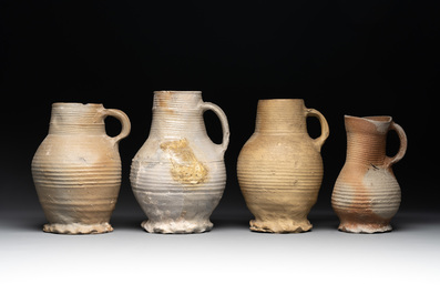 A collection of 8 German proto stoneware ribbed jugs, including 'Jacobakans', 14th C.