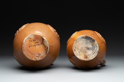 Two armorial stoneware jugs, Raeren, one dated 1586, 16/17th C.