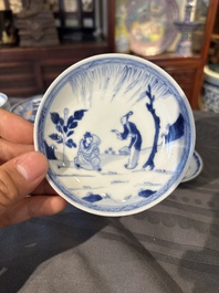 15 Chinese blue and white saucers and 13 cups with figural design, Kangxi/Yongzheng