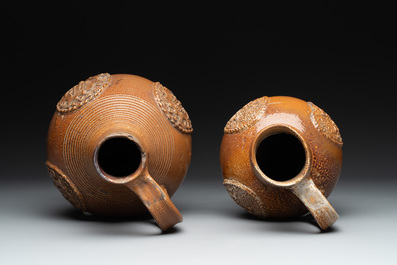 Two armorial stoneware jugs, Raeren, one dated 1586, 16/17th C.