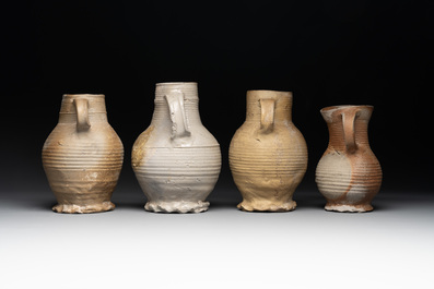 A collection of 8 German proto stoneware ribbed jugs, including 'Jacobakans', 14th C.