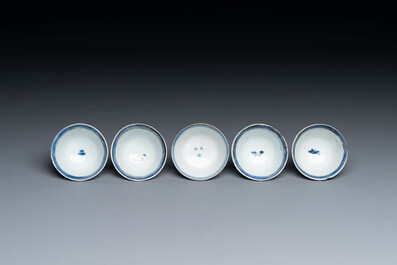 15 Chinese blue and white saucers and 13 cups with figural design, Kangxi/Yongzheng