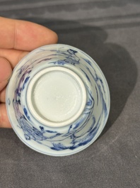 15 Chinese blue and white saucers and 13 cups with figural design, Kangxi/Yongzheng