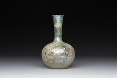 A Roman glass bottle with a conical neck, 4/5th C.