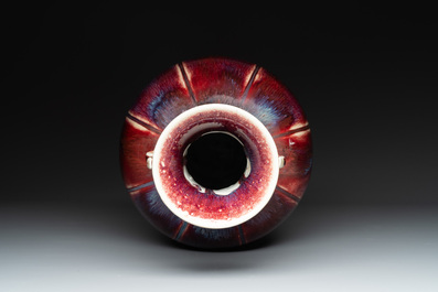 A Chinese flamb&eacute;-glazed vase with archaistic dragon handles, 19th C.