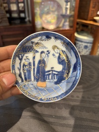 15 Chinese blue and white saucers and 13 cups with figural design, Kangxi/Yongzheng