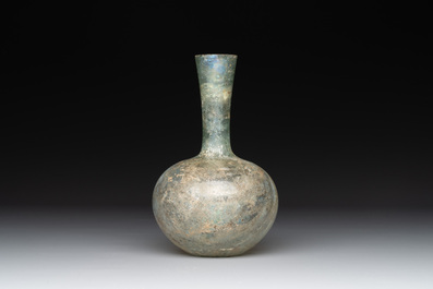 A Roman glass bottle with a conical neck, 4/5th C.