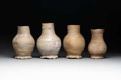 A collection of 8 German proto stoneware ribbed jugs, including 'Jacobakans', 14th C.