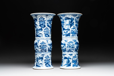 Two Chinese blue and white 'gu' vases with landscape and floral panels, Kangxi