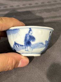 15 Chinese blue and white saucers and 13 cups with figural design, Kangxi/Yongzheng