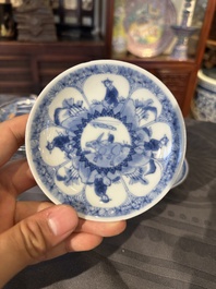 15 Chinese blue and white saucers and 13 cups with figural design, Kangxi/Yongzheng