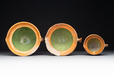 A collection of 10 parcel-glazed pottery so-called &lsquo;grapen&rsquo;, tripod cooking pots, 14th/17th C.