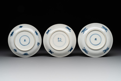 Two Chinese blue and white cups and three saucers with figural design, Kangxi and later