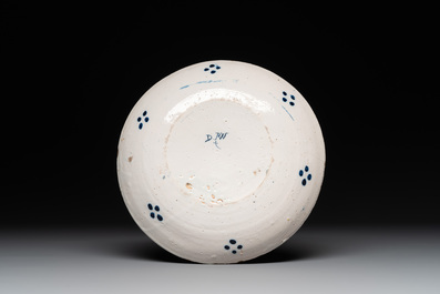 Seven Dutch Delft polychrome 'flower basket' plates, 18th C.