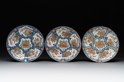 Seven Dutch Delft polychrome 'flower basket' plates, 18th C.