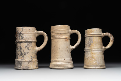 A 18-piece study collection of stoneware mugs, drinking vessels, pottery and stoneware oil lamps, mainly Germany, 15th C. and later