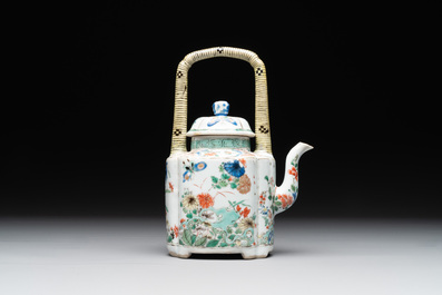 A Chinese famille verte 'flower and butterfly' teapot with an upright handle, Kangxi
