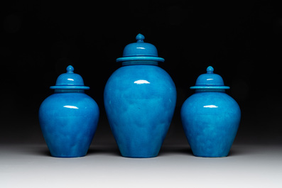 Three Chinese turquoise-glazed covered vases and a lavender-blue-glazed vase, Kangxi mark, 19/20th C.