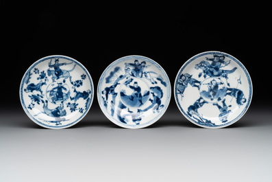 Two Chinese blue and white cups and three saucers with figural design, Kangxi and later