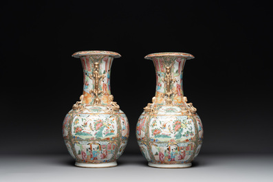 A pair of Chinese Canton famille rose vases with narrative design, 19th C.