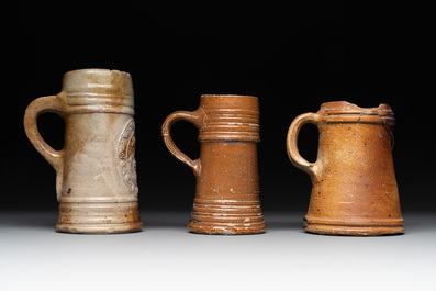 A 18-piece study collection of stoneware mugs, drinking vessels, pottery and stoneware oil lamps, mainly Germany, 15th C. and later