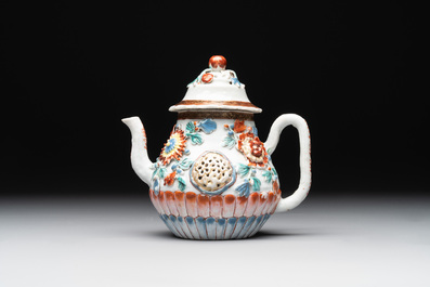 A Chinese famille rose teapot and stand with floral relief design, Qianlong