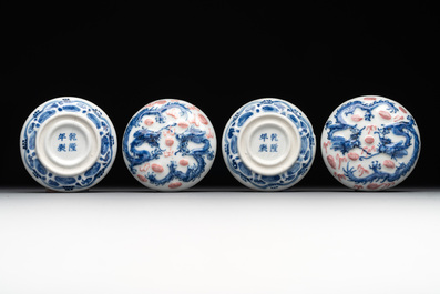A pair of Chinese blue and white and a pair of blue, white and copper-red seal paste boxes, Kangxi and Qianlong mark, 19th C.
