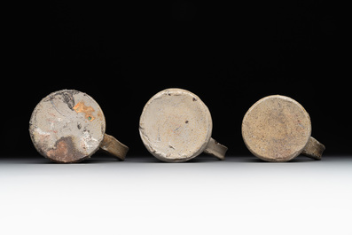 A 18-piece study collection of stoneware mugs, drinking vessels, pottery and stoneware oil lamps, mainly Germany, 15th C. and later