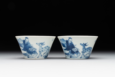 Two Chinese blue and white cups and three saucers with figural design, Kangxi and later