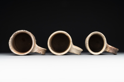 A 18-piece study collection of stoneware mugs, drinking vessels, pottery and stoneware oil lamps, mainly Germany, 15th C. and later