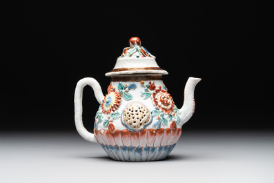 A Chinese famille rose teapot and stand with floral relief design, Qianlong