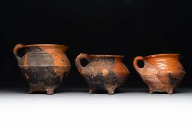 A collection of 10 parcel-glazed pottery so-called &lsquo;grapen&rsquo;, tripod cooking pots, 14th/17th C.