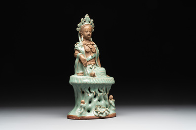A Chinese Longquan celadon Guanyin, Ming or later