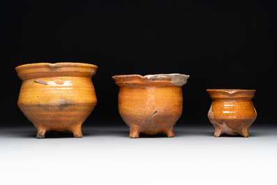 A collection of 10 parcel-glazed pottery so-called &lsquo;grapen&rsquo;, tripod cooking pots, 14th/17th C.