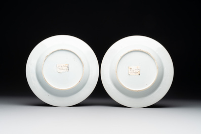 A pair of Chinese famille rose 'ladies in a garden' plates, Yongzheng