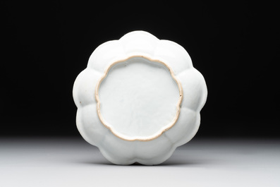 A Chinese famille rose teapot and stand with floral relief design, Qianlong