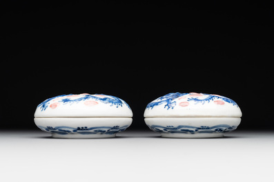 A pair of Chinese blue and white and a pair of blue, white and copper-red seal paste boxes, Kangxi and Qianlong mark, 19th C.
