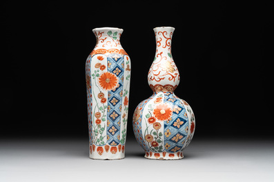 Two polychrome Dutch Delft petit feu vases with floral design, early 18th C.