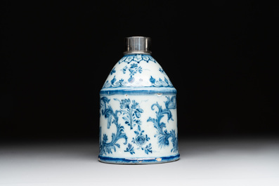 A Dutch Delft blue and white tea caddy with a pipe smoker, 18th C.