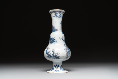 A Dutch Delft blue, white and manganese pear-shaped chinoiserie vase, late 17th C.