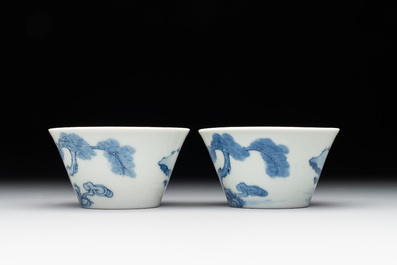 Two Chinese blue and white cups and three saucers with figural design, Kangxi and later