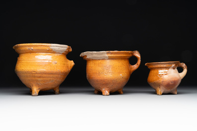 A collection of 10 parcel-glazed pottery so-called &lsquo;grapen&rsquo;, tripod cooking pots, 14th/17th C.