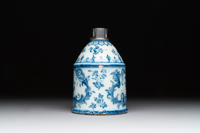A Dutch Delft blue and white tea caddy with a pipe smoker, 18th C.