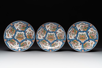 Seven Dutch Delft polychrome 'flower basket' plates, 18th C.