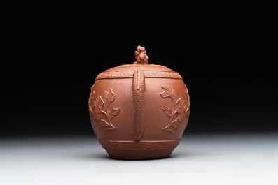 A Chinese Yixing stoneware teapot with relief design, Kangxi