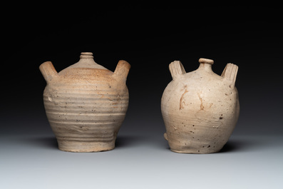 Five stoneware jugs or pilgrim flasks, including a Raeren example with armorial design, 16/17th C. and later