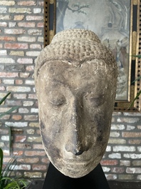 A Thai sandstone head of Buddha, possibly Ayutthaya period, 14/15th C.