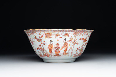 A Chinese iron-red and gilt-decorated 'ladies in a garden' bowl, Kangxi