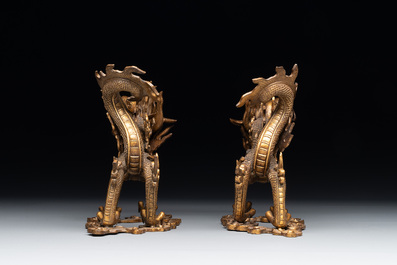 A pair of Chinese gilt bronze dragons among flames and clouds, 19/20th C.
